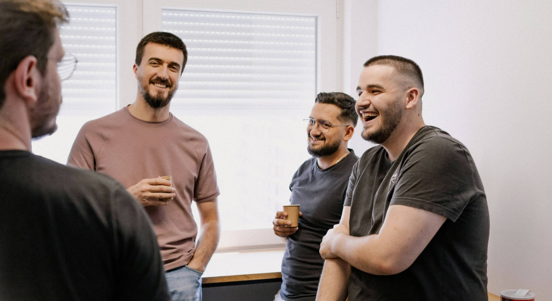 4 men hanging out talking