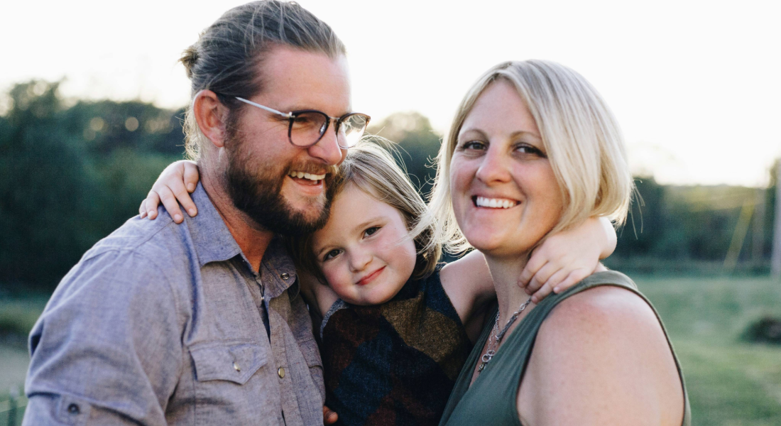Husband and wife with their daughter